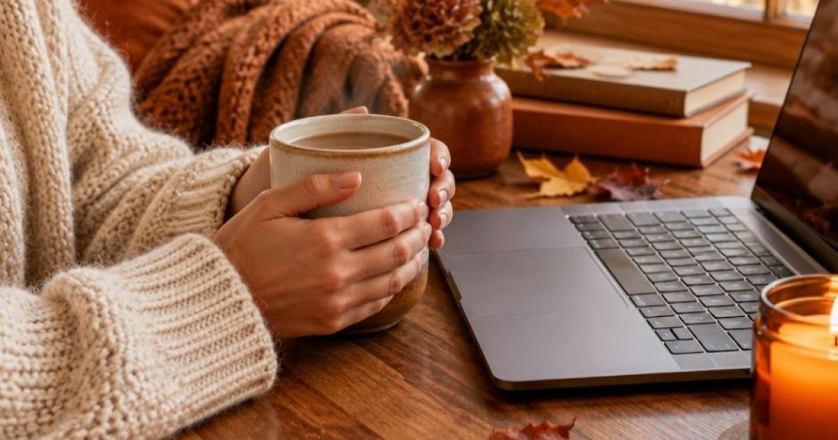Mum with a cup of coffee working calmly at her laptop